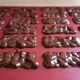 Photo of all the molds filled with chocolate and our Butterfinger filling